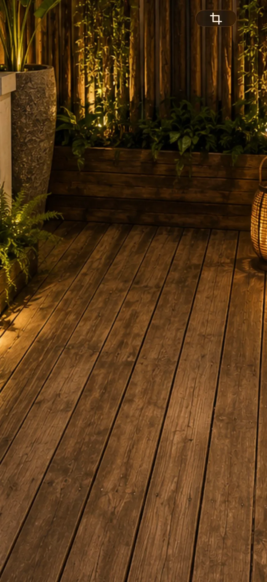 The wooden garden deck, planted along both sides.